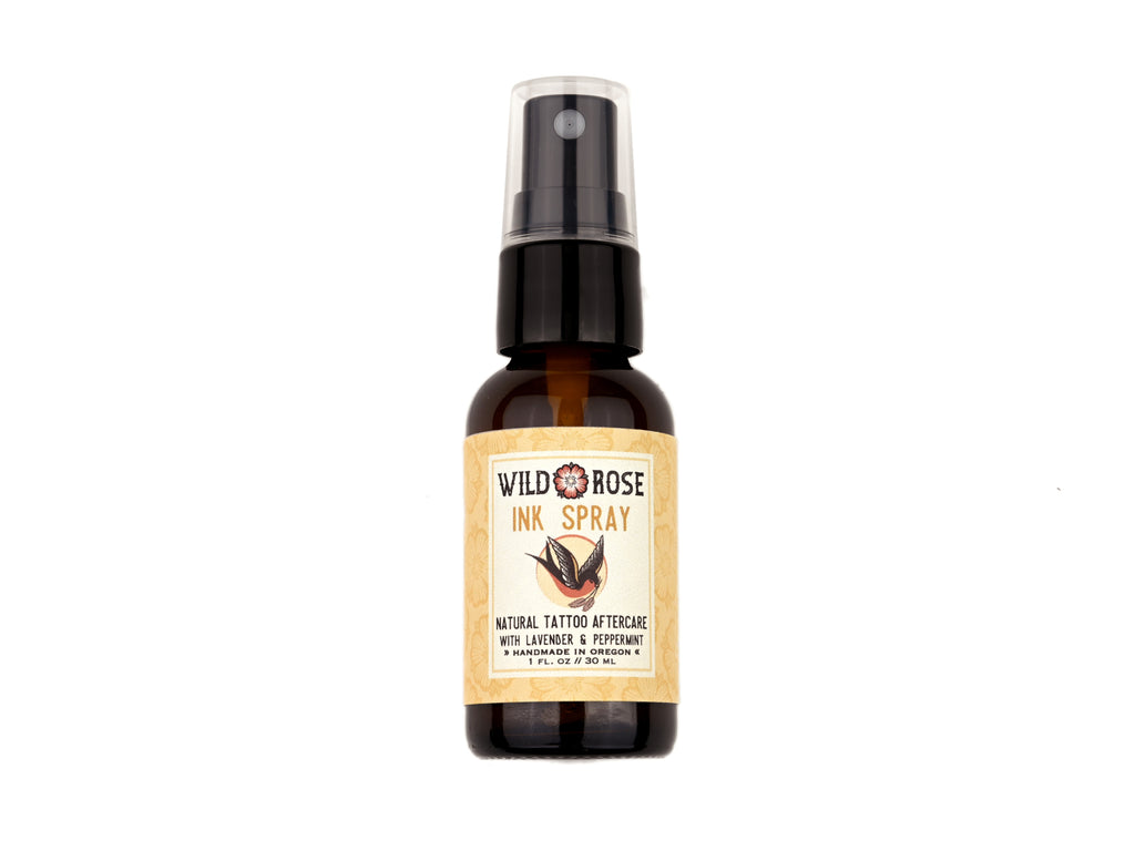 Ink Spray Natural Tattoo Aftercare in a 1oz amber spray bottle on a white background.