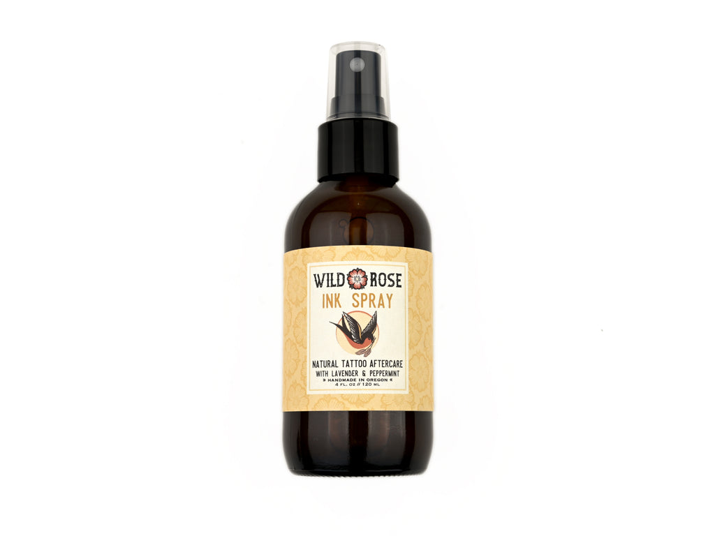 Ink Spray Natural Tattoo Aftercare in a 4oz amber spray bottle on a white background.