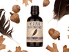 Wild Man Beard Oil Conditioner - Raven scent in 50ml amber glass bottle.Black feathers, acorns and dried oak leaves surround. 