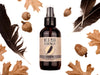 Wild Man Beard Wash - Raven scent in 4oz amber glass bottle. Black feathers, acorns and dried oak leaves surround. 