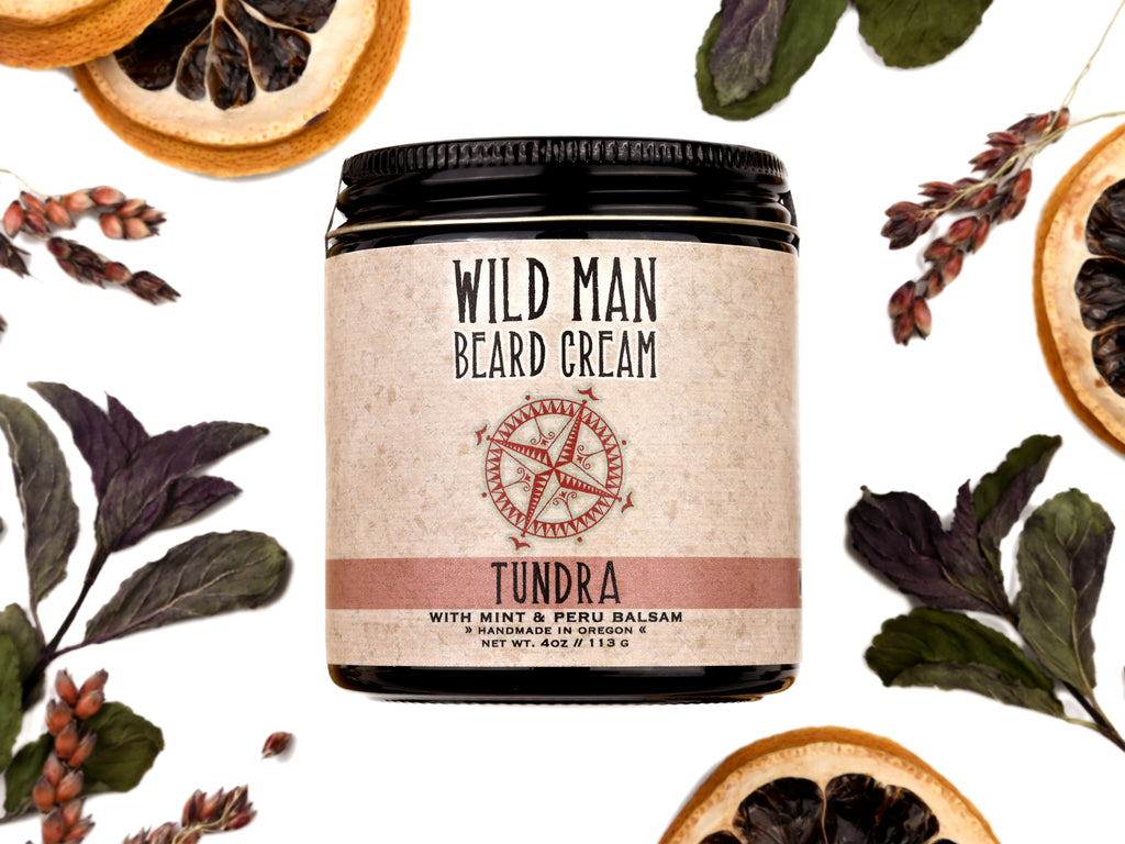 Wild Man Beard Softening Cream Tundra scent in 1oz amber glass jar. Lemon slices and peppermint leaves surround.