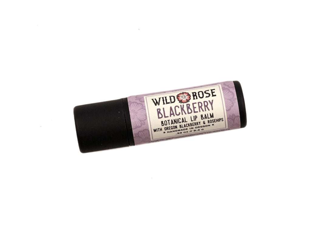 Blackberry Natural Lip Balm in a biodegradable paper tube on a white background.