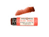 Wild Rose Blood Orange Botanical Lip & Cheek Tint stick with a coral pink label and black-and-white patterned cap, shown horizontally with a swipe of the orange-red tint above it on a white background.
