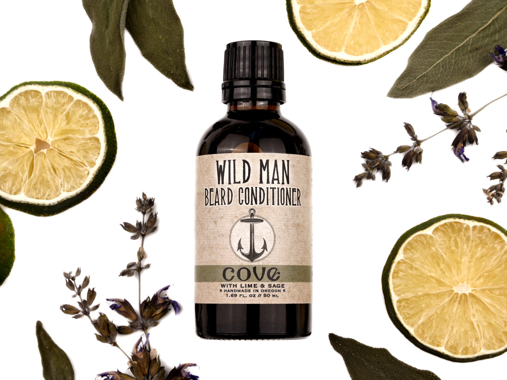 Wild Man Beard Oil Conditioner Cove scent in 50ml amber glass bottle. Lime slices and sage leaves surround.