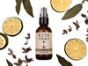 Wild Man Beard Wash Cove scent in 2oz amber bottle. Lime slices and sage leaves surround.