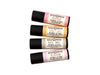 Garden Lip Balm Set with Rosebud, Honey Bee, Basil Mint and Blossom in biodegradable paper tubes on a white background.