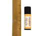 Natural Lip Balm in biodegradable tube show next to ruler at about 3" tall.