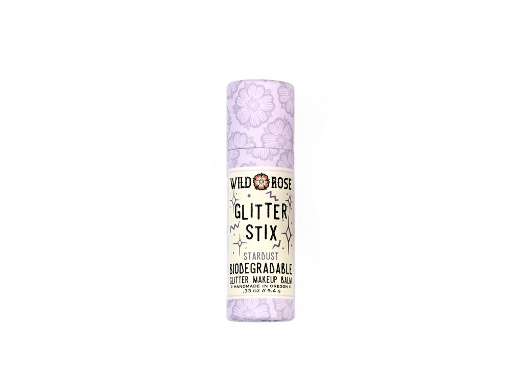 Wild Rose Biodegradable Glitter Stix makeup balm in Stardust on a white background.