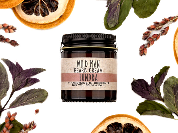 Wild Man Beard Softening Cream Tundra scent in 1oz amber glass jar. Lemon slices and peppermint leaves surround.