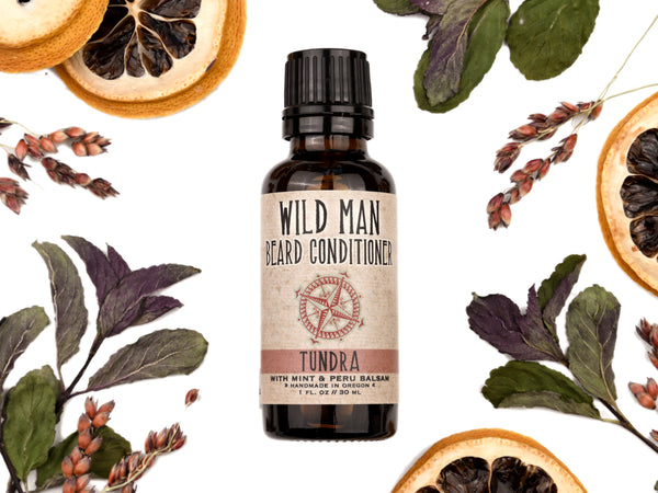 Wild Man Beard Oil Conditioner Tundra scent in 30ml amber glass bottle. Lemon slices and peppermint leaves surround.