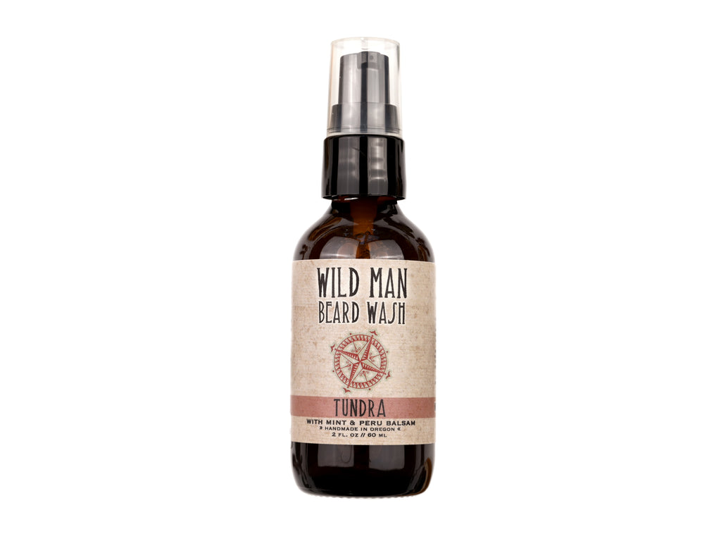 Wild Man Beard Wash Tundra scent in 2oz amber glass bottle on white background.