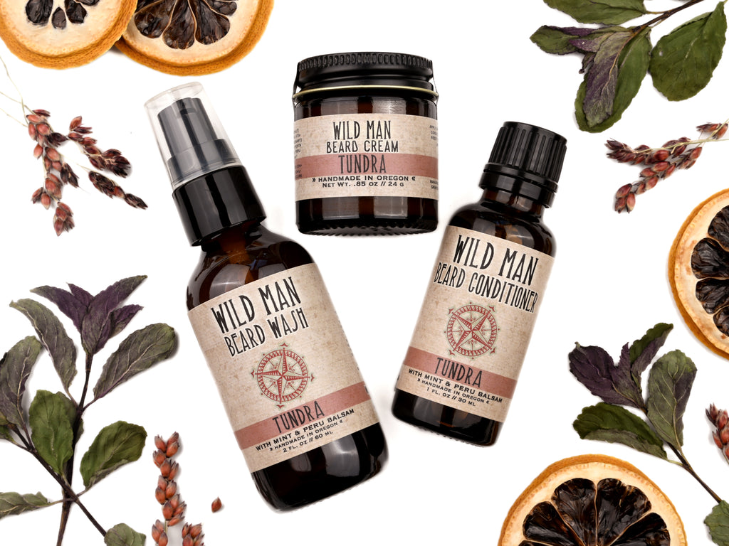 Wild Man beard care set in Tundra scent with 30ml Beard Conditioner, 2oz Beard Wash and 1oz Beard Cream. Lemon slices and peppermint leaves surround.
