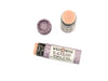 Blackberry Natural Lip Balm in a biodegradable paper tube on a white background. The cap is off revealing a creamy soft pink balm. 