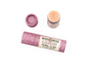 Elderberry Natural Lip Balm from Wild Rose  in a biodegradable paper tube on a white background. The cap is off revealing a creamy, light pink balm.