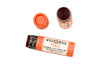 Wild Rose Peach Botanical Lip & Cheek Tint in a biodegradable paper tube on a white background. The cap is removed, revealing a red-orange tint.