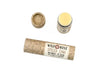 Wild Rose Spiced Chai Lip Balm in a biodegradable tube on a white background. The cap is off revealing a creamy white balm.