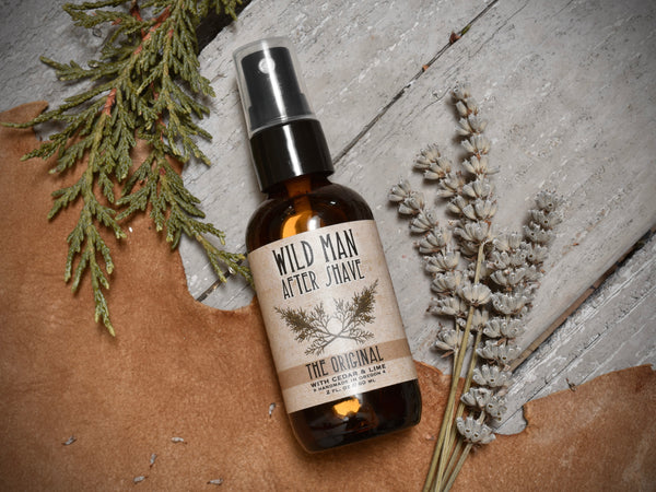 WIld Man After Shave 2oz amber glass bottle in The Original scent. Dried botanicals surround.