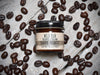 Wild Man Beard Softening Cream 1oz amber glass jar in Dark Roast scent. Coffee beans surround.