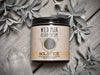 Wild Man Beard Softening Cream Solstice in 4oz amber glass jar. Mugwort leaves and quartz crystals surround.