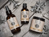 Wild Man beard care set in Solstice scent with 50ml Beard Conditioner, 4oz Beard Wash and 4oz Beard Cream. Mugwort leaves and quartz crystals surround.