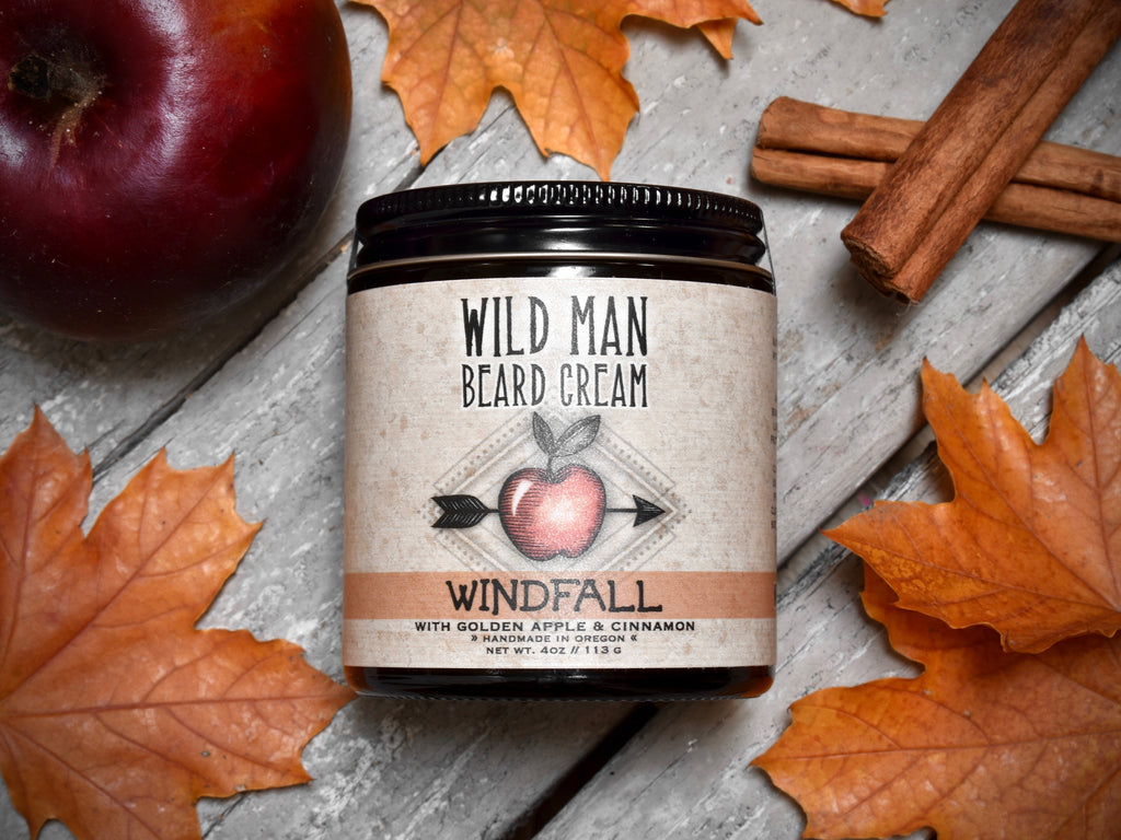 Wild Man Softening Beard Cream Windfall in 4oz amber glass jar. Apples and cinnamon sticks surround.