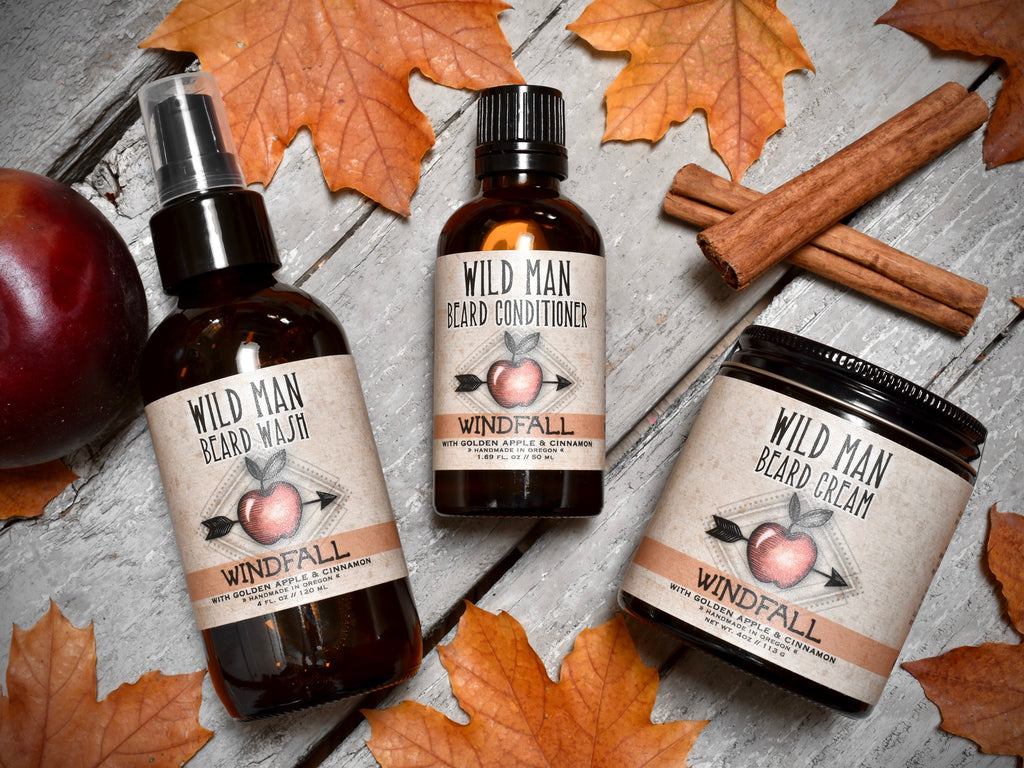 Wild Man beard care set in Windfall scent with 50ml Beard Conditioner, 4oz Beard Wash and 4oz Beard Cream. Apples and cinnamon sticks surround.