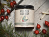 Wild Man Beard Softening Cream 4oz amber glass jar in Yule scent. Rosehips and pine boughs surround.